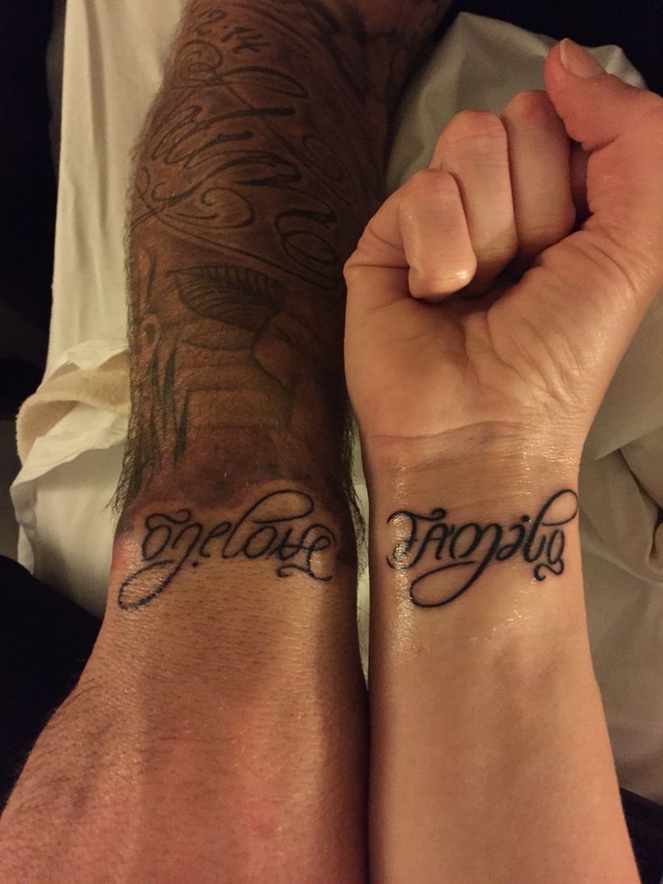 two people holding hands with tattoos on their arms that say,'fragile'and'forgotten '