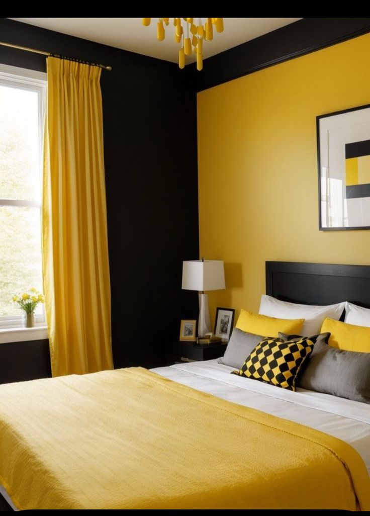 a yellow and black bedroom with a chandelier hanging from the ceiling, two lamps on either side of the bed