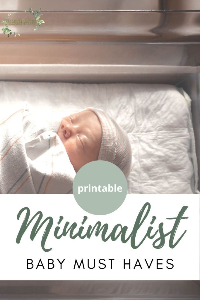 a baby in a crib with the text printable minimalist baby must haves