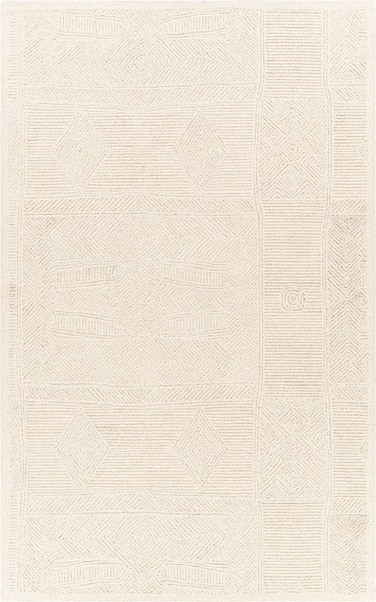 a white rug with an intricate design on it