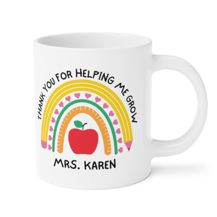 a white coffee mug with an apple and rainbow on the inside, says thank you for helping