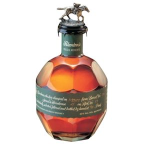 a bottle of brandy with a horse on top