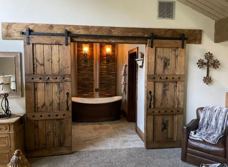 a bathroom with wooden doors and a tub