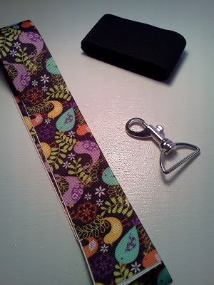 a tie and keychain sitting on top of a table