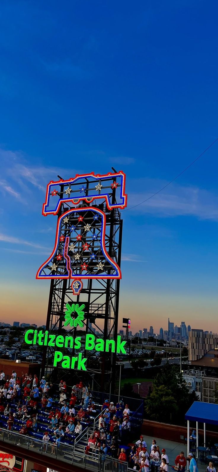 the sign for citizens bank park is lit up in red, white and blue colors