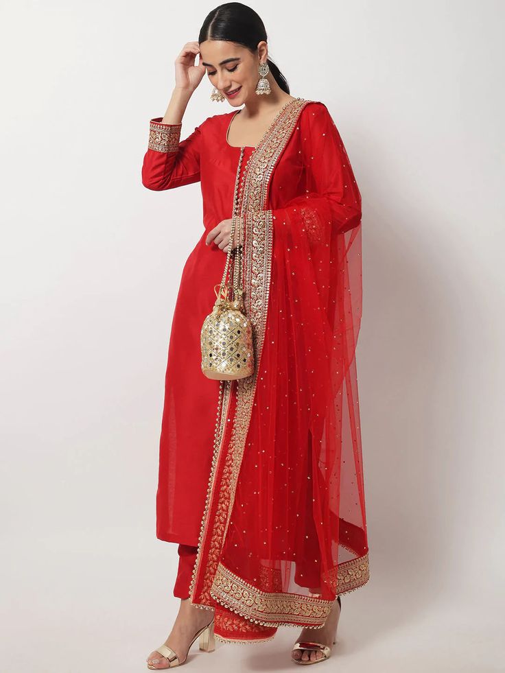 This is a beautiful 3 piece suit set. It comes with thread embellished straight cut kurta has 3/4th sleeves, round neck, calf length teamed with solid trouser pants and a net dupatta with zari & stones detailing. 3 piece set Color- Red Work- Beads & Zari Embellished Detailing Kurti Length - 46 inch Kurta Fabric-Silk Bottom Fabric - Silk Dupatta Fabric-Net with Zari & Stones Detailing Sleeves-3/4th Sleeves Neck-Round Neck Care - Dry Clean Note - The set does not include potli bag Luxury Red Straight Kurta Traditional Wear, Luxury Red Anarkali Set With Dupatta, Luxury Katan Silk Unstitched Suit With Zari Work, Luxury Unstitched Straight Kurta Anarkali Set, Luxury Red Unstitched Suit With Mirror Work, Luxury Dola Silk Unstitched Suit For Diwali, Luxury Silk Thread Unstitched Suit With Dupatta, Luxury Anarkali Set With Meenakari Straight Kurta, Luxury Bollywood Silk Unstitched Suit