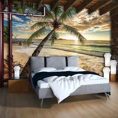 a bedroom with a palm tree mural on the wall and a bed in front of it