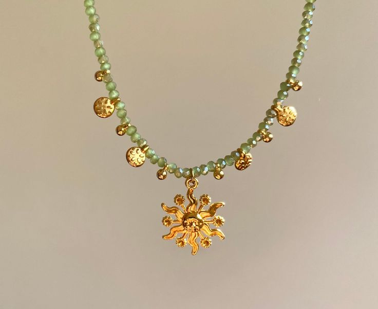 This necklace reminds me of Sicily with its bright sun and beautiful green beads! The gold-plated flower charms add more fun! It's such a Mediterranean neckpiece! Length: The necklaces are adjustable thanks to an extendable chain. Care instructions: Avoid contact with water or chemicals to preserve the gold plating and shine Cheap Spiritual Green Necklaces, Spiritual Necklace Green, Cheap Green Spiritual Necklace, Affordable Fun Beaded Chain Jewelry, Affordable Summer Jewelry With Star Charm, Cheap Symbolic Beaded Jewelry, Cheap Green Round Charm Necklaces, Cheap Hippie Necklaces For Gifts, Affordable Yellow Beach Jewelry