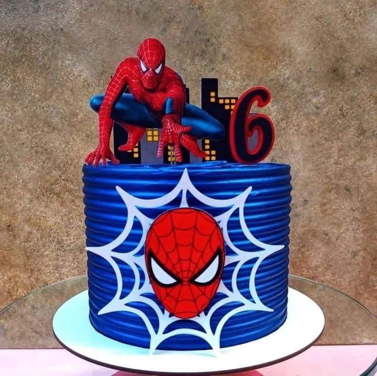 a spiderman birthday cake with the number six on it