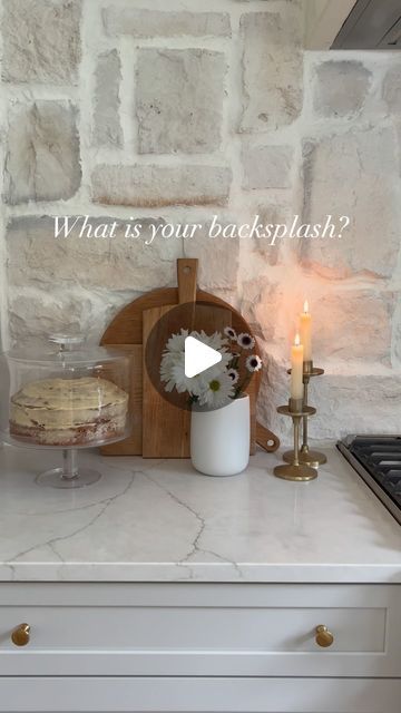 a kitchen counter with a candle and cake on it that says what is your backsplash?