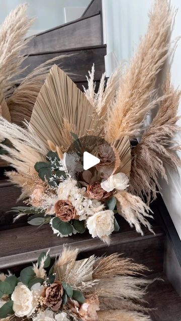 some flowers and feathers are sitting on the stairs