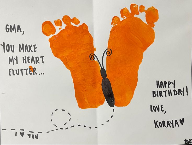 an orange hand and foot print on a piece of paper that says, giraffe you make my heart flutter happy birthday love kora