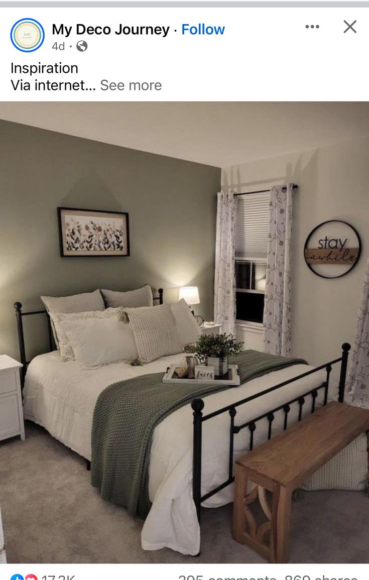 a bed room with a neatly made bed and a wooden bench next to the window