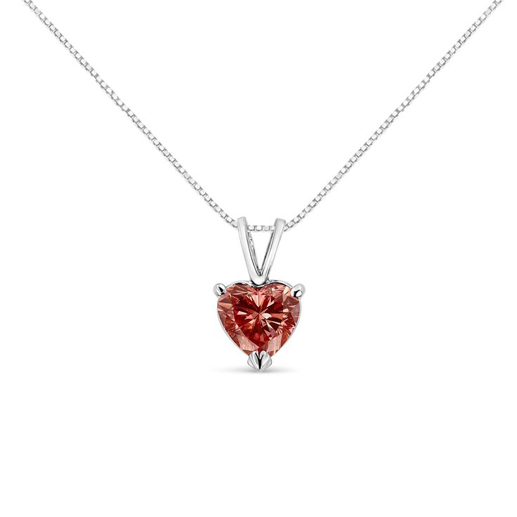 An elegant heart-shaped diamond is the brilliant focal point of this solitaire necklace for her. Set in 14K white gold, this stunning, pink lab grown diamond suspends from an 18-inch box chain that secures with a spring ring. The diamond is masterfully set in a 3 prong, martini setting for maximum dazzle. The simplicity of a perfect diamond will outlast every other piece you own. A brilliantly cut heart shaped diamond emanates pure elegance and love in its gold setting. Goes with anything you care to pair it with – another reason why you'll never want to take this one off. This sweet necklace makes a perfect Valentine's Day gift, or as a way to remember someone close to your heart. It's a classic and feminine piece she'll want to show off every day. Martini Set, Diamond Heart Pendant Necklace, Sweet Necklace, Solitaire Necklace, Pure Elegance, Solitaire Pendant Necklace, Heart Necklace Diamond, Heart Diamond, Solitaire Necklaces