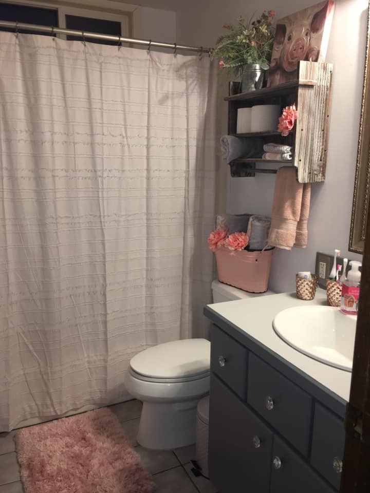 the bathroom is clean and ready to be used as a shower curtain for the bathtub