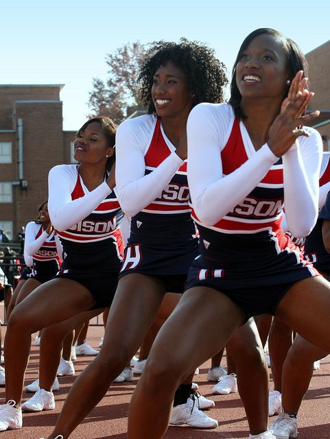 a group of women in cheerleader outfits