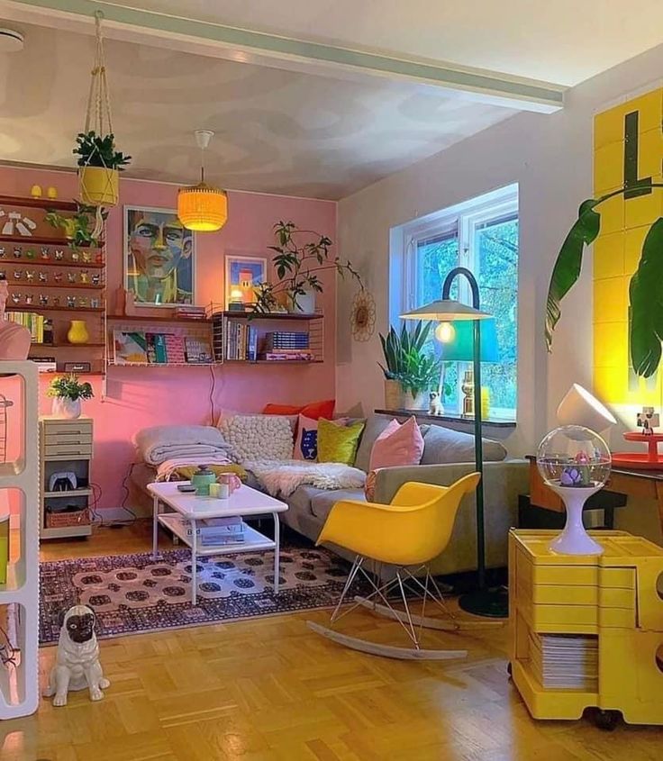 a living room filled with furniture and lots of plants on top of the shelves next to a window