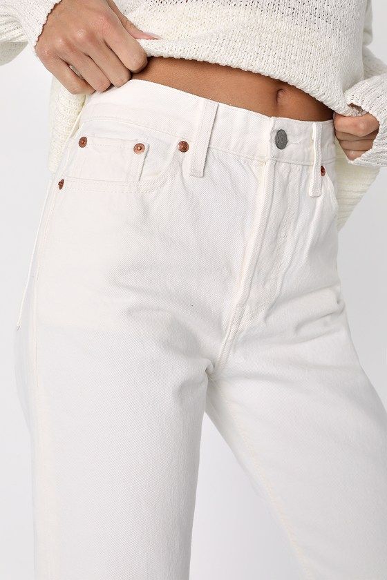 We just can't get enough of the Levi's Wedgie Straight White High-Rise Cropped Jeans! Sturdy denim (in Levi's In the Cloud's wash) forms these incredibly cute and on-trend jeans with a five-pocket cut, belt loops, and high-waisted fit. Branded top button and hidden button fly top straight pant legs with cropped hems. Red logo tag and leather patch at back. Fit: This garment fits true to size. Length: Ankle length. Size 28 Inseam: 27.00 Front Rise: 10.00 Waist: Fitted - very fitted at natural wai Classic White Cropped Leg Jeans, Classic White Cropped Jeans, White Classic Cropped Leg Bottoms, Classic White Cropped Leg Bottoms, Classic White Cropped Bottoms, Levi's White Straight Leg Jeans, Levi's White Jeans With Pockets, Classic White Jeans With Standard Cut Leg, White Classic Jeans For Fall