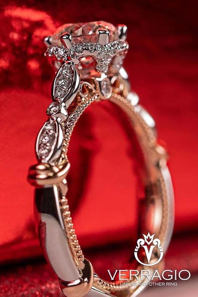 a close up view of a wedding ring with diamonds on it's sidestone