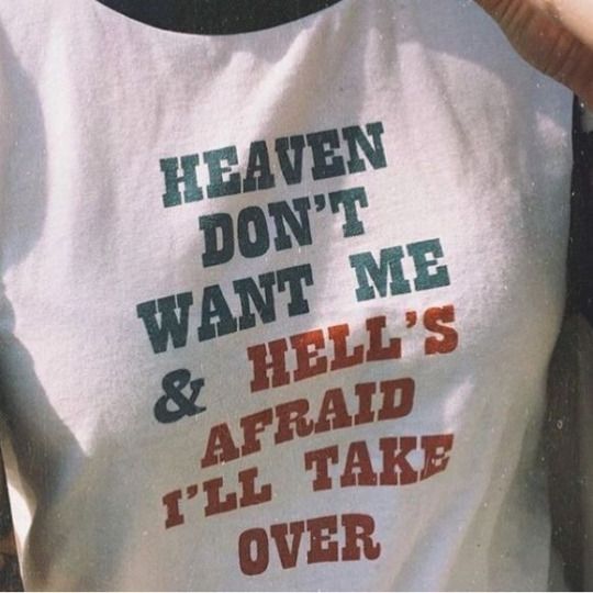 someone wearing a t - shirt that says heaven don't want me and hell's afraid i'll take over