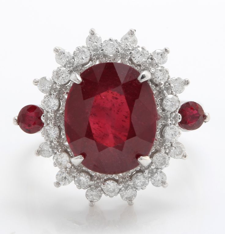 "5.30 Carat Natural Red Ruby and Diamond Women Ring Made in 14K Solid White Gold Suggested Retail Value $5,999.00 Total Natural Ruby Weight is - 4.70 Carat Ruby Measurements are - 11.00 X 9.00 mm Total Round Diamonds Carat Weight is - .60 Carat Clarity: SI1 Color: G-H RING SIZE: 7 (FREE SIZING AVAILABLE) RING WEIGHT IS 6.4 gram \"Disclaimer: \"All colors, measurements and weights are approximate and may vary slightly from the listed dimensions or as seen in the image''" Luxury Red Ruby Gemstone Ring, Luxury Red Ruby Ring With Vvs Clarity, Luxury Red Diamond Ring With Gemstone, Luxury Red Gemstone Diamond Ring, Luxury Red Ruby Ring For Formal Occasions, Gia Certified Oval Red Diamond Ring, Luxury Red Oval Rings, Luxury Ruby Cluster Ring, Red Cluster Diamond Ring With Brilliant Cut