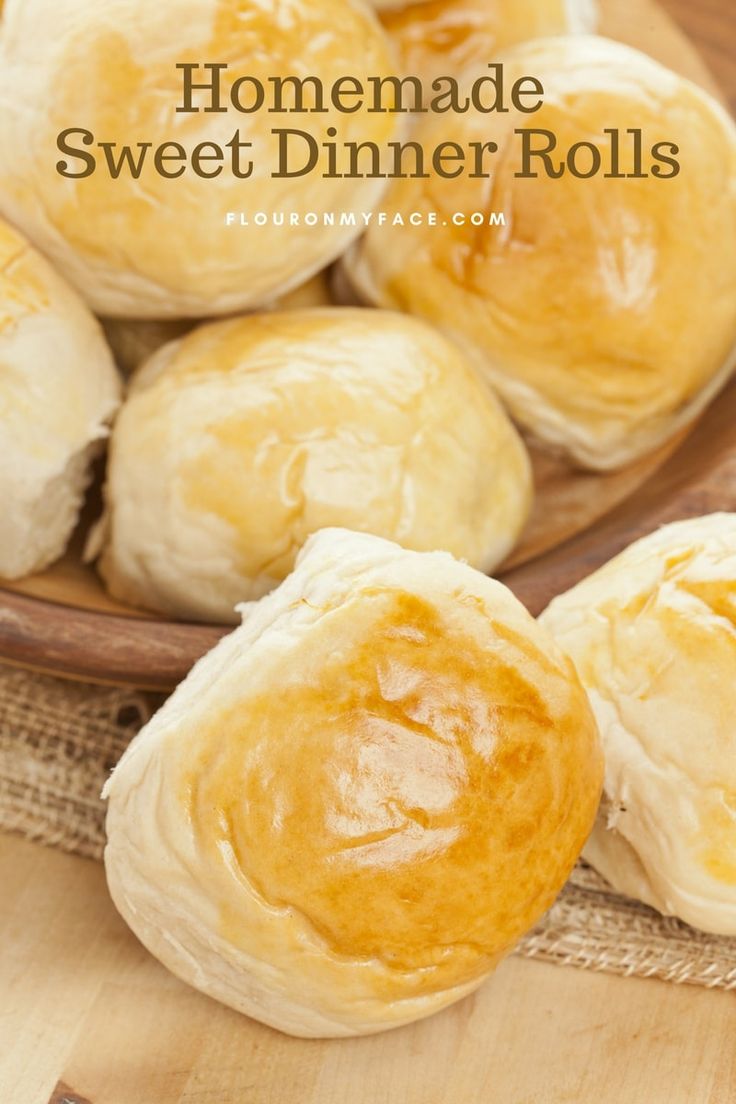 homemade sweet dinner rolls on a wooden plate