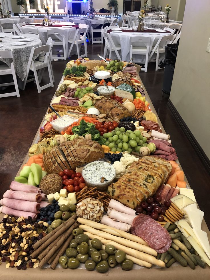 a long table filled with lots of different types of food