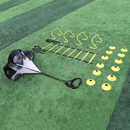 a black and white umbrella on the ground with some yellow circles around it that have been cut out