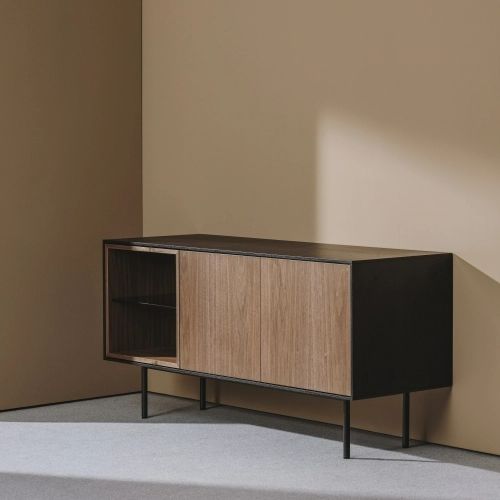 a wooden cabinet sitting on top of a floor next to a wall