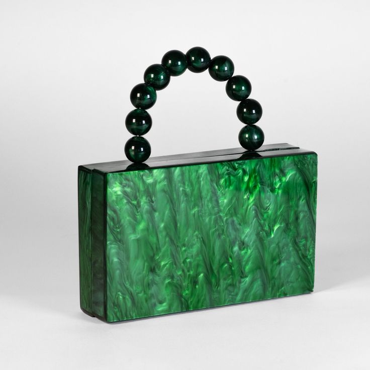 Discover elegance with our acrylic clutch, available in timeless white and vibrant green. Each clutch features a sophisticated top handle, blending style and functionality seamlessly. Elevate your accessory with these chic essentials that effortlessly complement any ensemble. Trendy Green Top Handle Evening Bag, Green Top Handle Evening Bag For Party, Green Top Handle Box Bag As Gift, Green Clutch Box Bag As Gift, Formal Handheld Green Box Bag, Chic Green Rectangular Evening Bag, Green Handheld Clutch For Evening, Green Rectangular Clutch As Gift, Trendy Green Box Bag For Evening