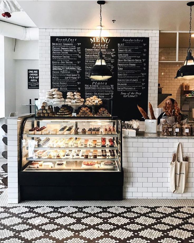 the inside of a bakery with lots of pastries on display