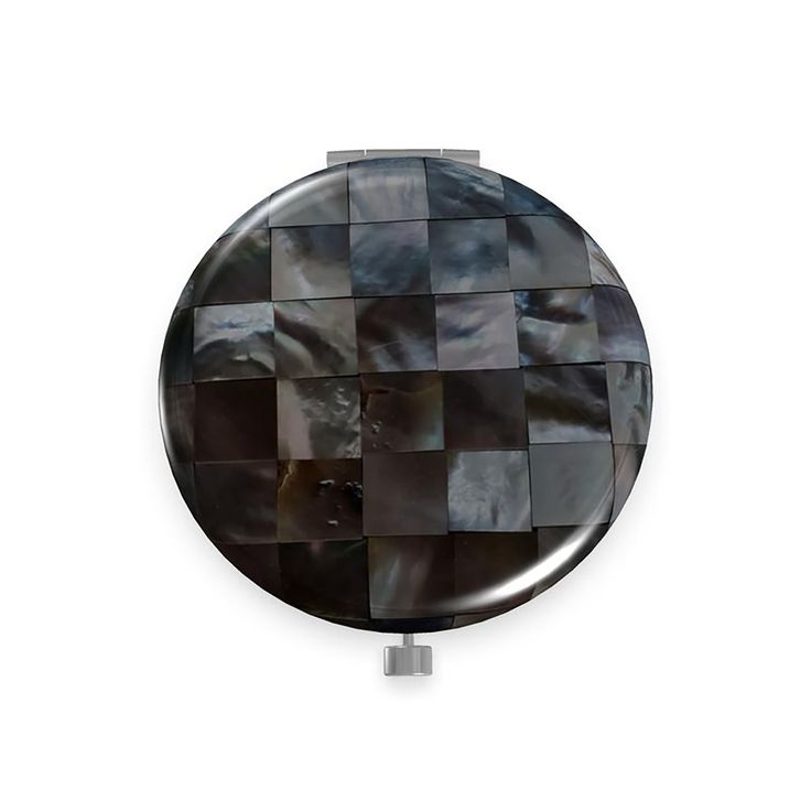 a black and white checkerboard pattern on a round mirror