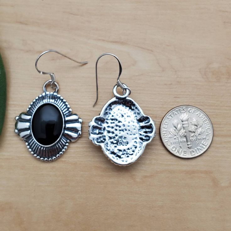 Visit our on-line shop at: Etsy.com/shop/AlbuquerqueDesigns *sterling silver earrings / big concho earrings *dangles / hooks / ear wires / boho earrings *southwestern *black onyx / black stone *calibrated pre-cut stones: big 14x10mm oval shape *back of jewelry items are all covered / do not show the back of stones *all jewelry items are made to ship, slight variations in stones will occur comparing to pictures. *size of a penny is 19mm or a dime is 18mm in diameter for comparing size with jewelr Black Sterling Silver Jewelry With Matching Earrings, Sterling Silver Black Enamel Drop Earrings, Sterling Silver Drop Earrings With Black Enamel, Black Enamel Sterling Silver Drop Earrings, Nickel-free Black Dangle Plug Earrings, Black Dangle Plug Earrings Nickel Free, Black Nickel-free Dangle Plug Earrings, Black Dangle Plug Earrings, Nickel Free Black Teardrop Jewelry