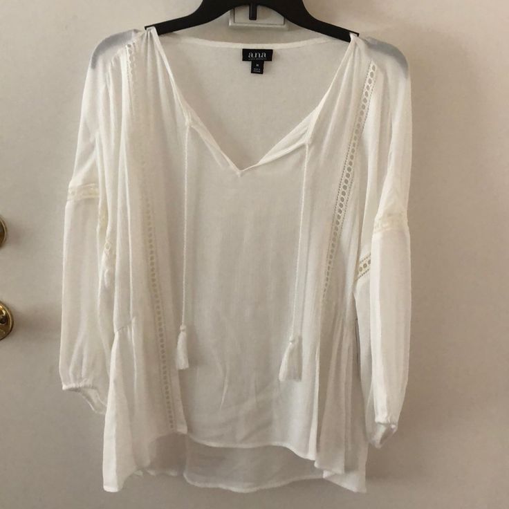 Brand New, With Tags, In Perfect Condition White/Cream Tassel Blouse. Sheer With Pretty Detail Cutouts. Sleeves Cinch In At The Bottom. Summer V-neck Tops With Tassels, Summer V-neck Top With Tassels, Casual V-neck Blouse With Tassels, Casual V-neck Peasant Top With Tassels, Summer V-neck Peasant Top With Tassels, Long Sleeve Tassel Tops For Vacation, Long Sleeve Tops With Tassels For Summer, White V-neck Top With Tassels, Casual Summer Peasant Top With Tassels