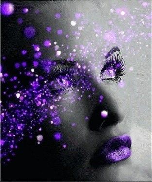 a woman's face with purple glitter on it