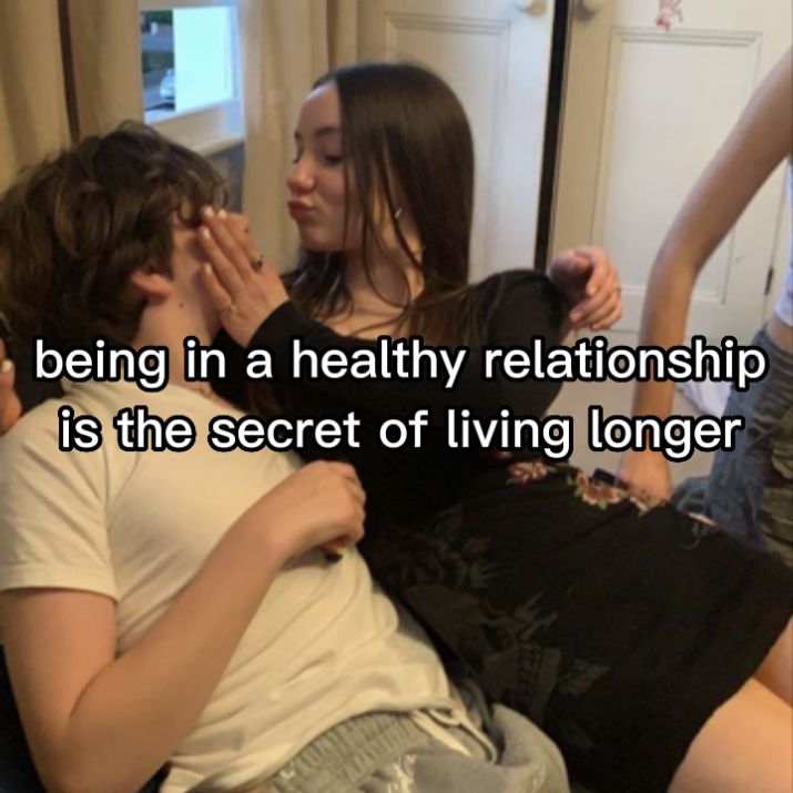 two people sitting on a couch with the caption being in a healthy relationship is the secret of living longer