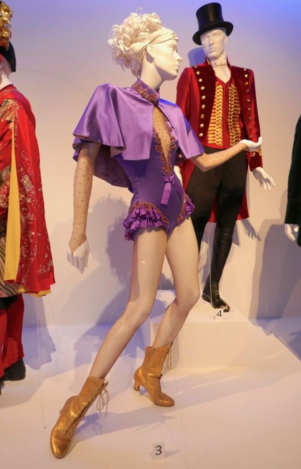 several mannequins dressed in costumes on display