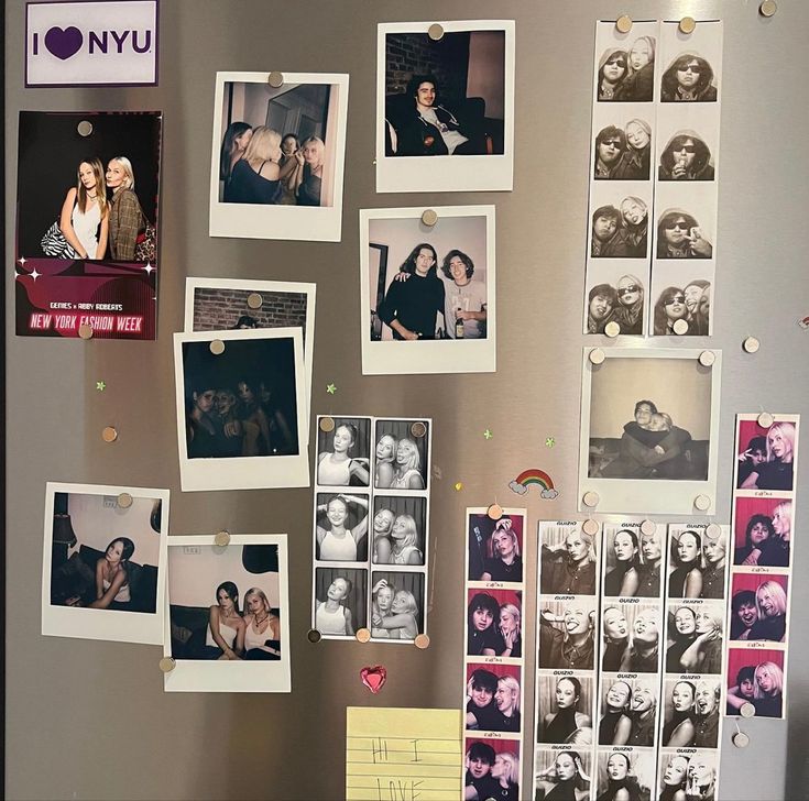 a refrigerator covered in pictures and magnets next to a wall with photos on it