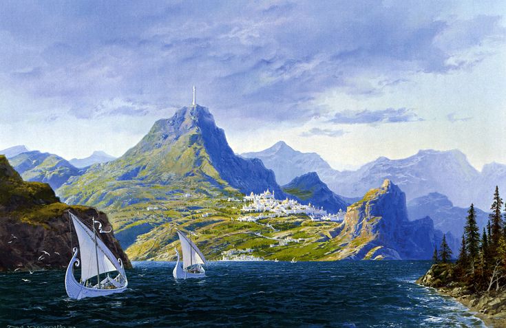 two sailboats in the water near some mountains