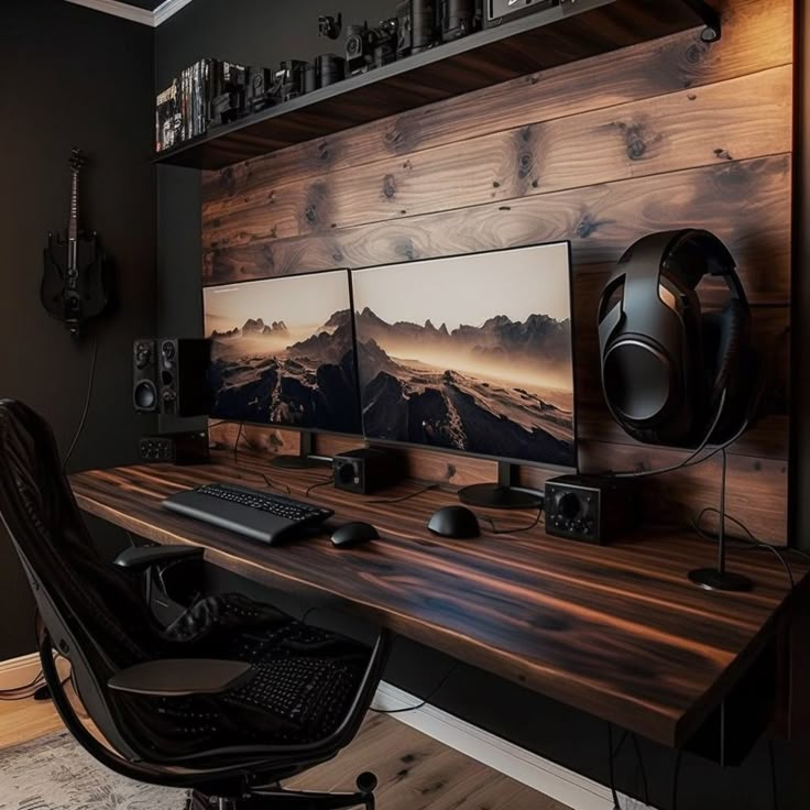 two computer monitors sitting on top of a wooden desk