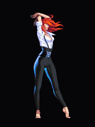 a woman in black and white is dancing with her red hair flying through the air