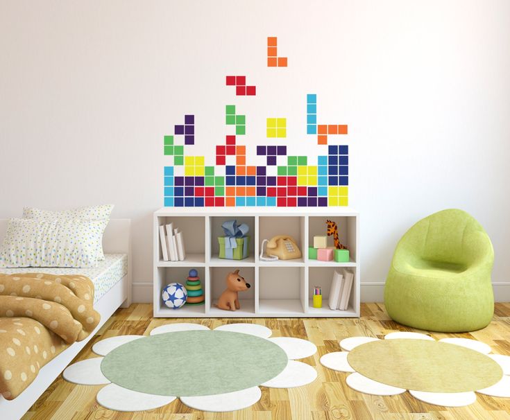 a child's room with colorful blocks on the wall