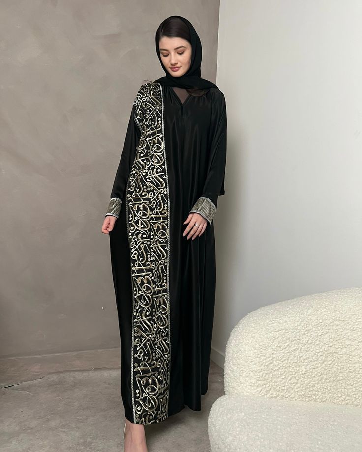 Traditional abaya styles Modest fashion abayas Black abaya designs Elegant abaya collections Embroidered abayas Abayas with embellishments Abaya fashion trends Designer abayas Customized abaya options Modern abaya variations Abayas for special occasions Abaya fabrics and materials Abaya color palette Abaya styling tips Abaya accessories Contemporary abaya designs Luxury abaya brands Abayas for different body types Abaya hijab combinations Abaya layering techniques Abaya craftsmanship Arabic Calligraphy Embroidery, Abaya Fashion Modern, Gold Arabic Calligraphy, Dubai Abaya Fashion, Calligraphy Embroidery, Arabic Abaya, Embroidery Abaya, Abaya Designs Latest, Abaya Fashion Dubai