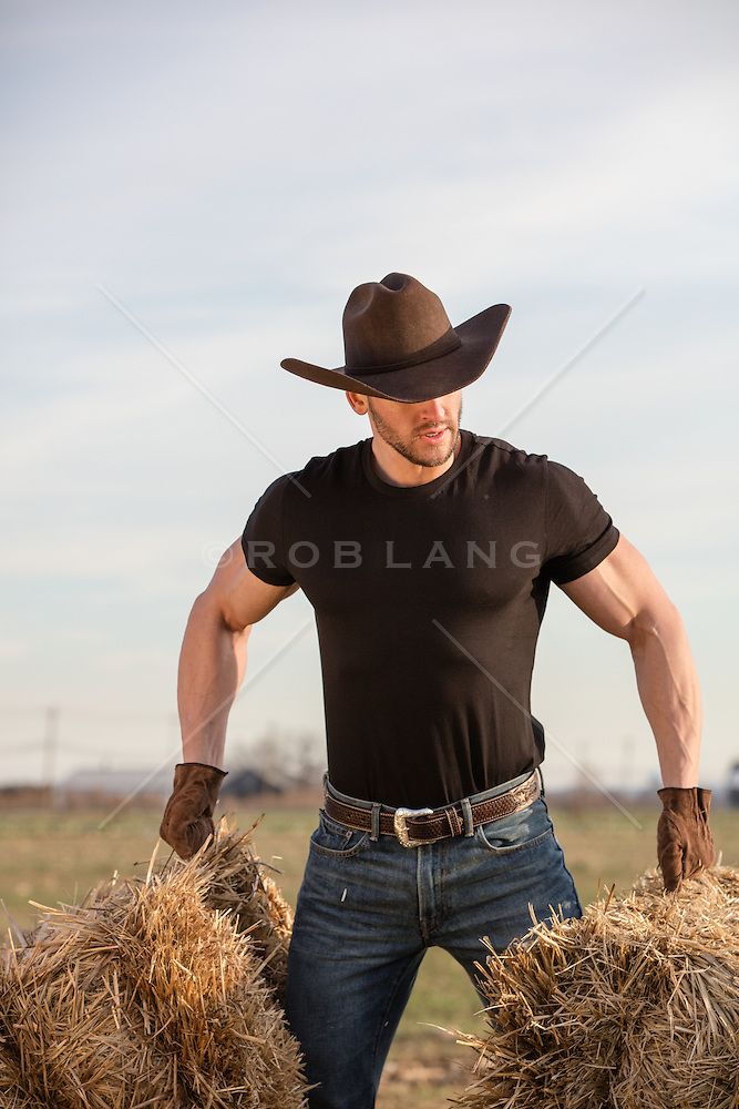 rugged muscular cowboy lifting hay bales on a ranch | ROB LANG IMAGES: LICENSING AND COMMISSIONS Black Cowboy Hat Outfit Men, Cowboy Hat Outfit Men, Cowboy Outfit For Men, Hat Outfit Men, Bales Of Hay, Cowboy Chaps, Farmer Outfit, Handsome Cowboys, Black Cowboy Hat