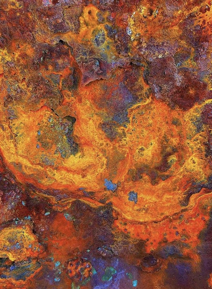 an abstract painting with orange, yellow and blue colors on it's surface is shown