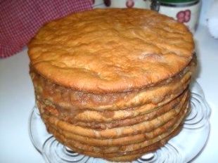 a stack of cake sitting on top of a glass plate