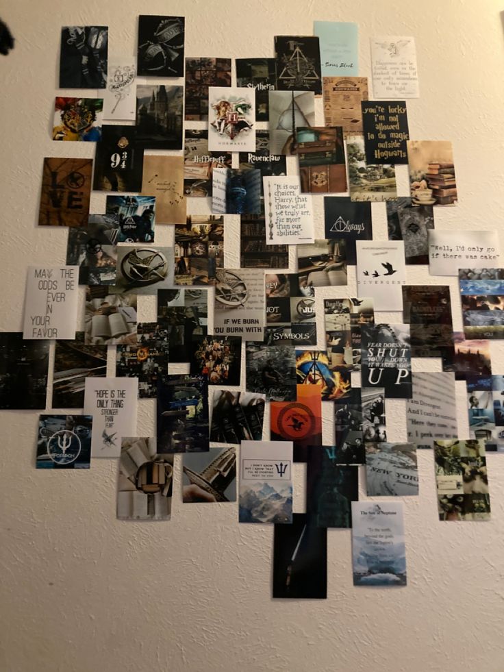 a white wall covered in lots of pictures and magnets on it's side