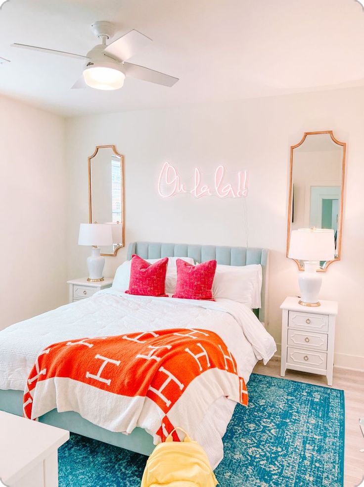 a bedroom with white walls and blue carpet