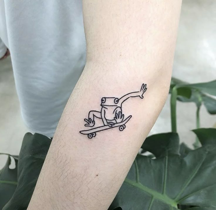 a person with a small tattoo on their arm