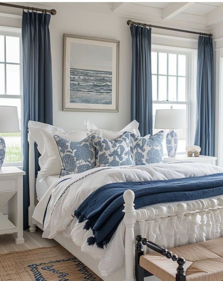 a bedroom with blue and white decor in it